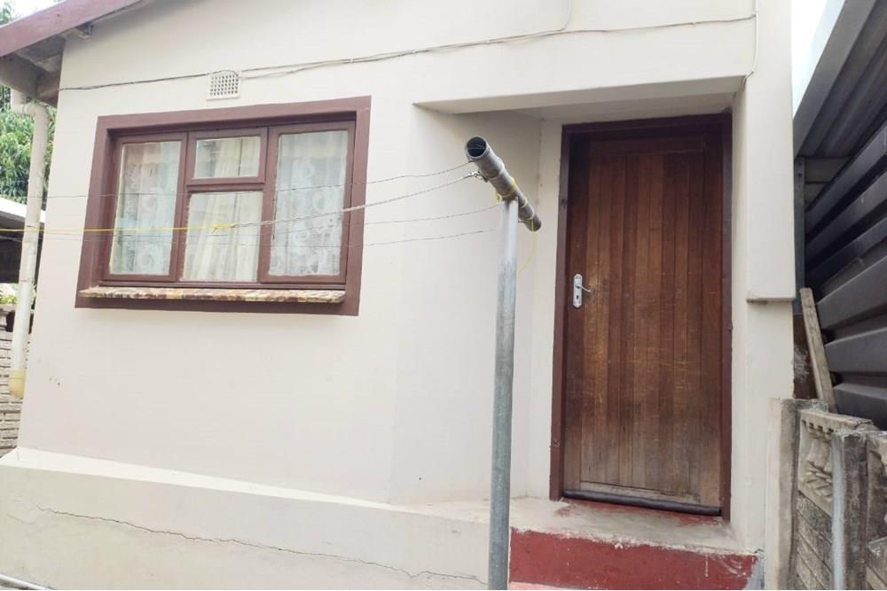 This Two Bedroom Double Storey House with a Double Storey Outbuilding
