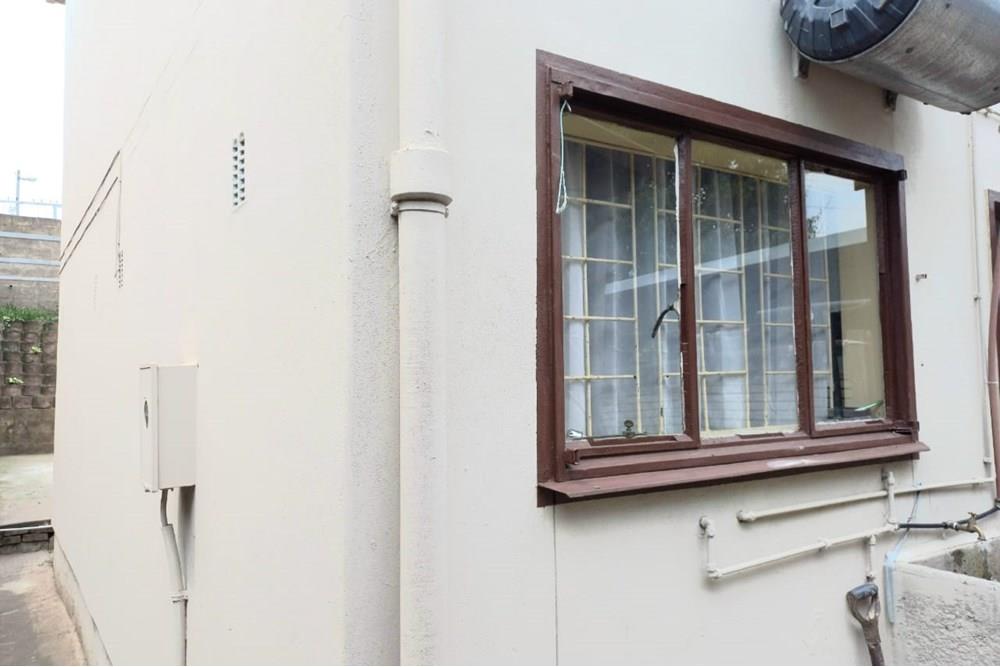 This Two Bedroom Double Storey House with a Double Storey Outbuilding