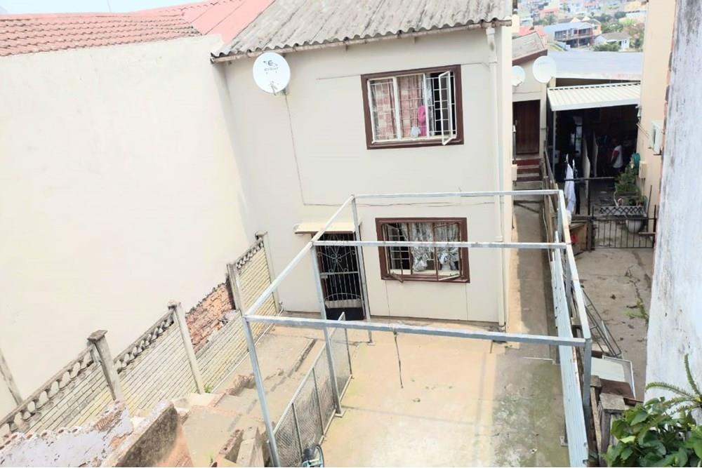 This Two Bedroom Double Storey House with a Double Storey Outbuilding