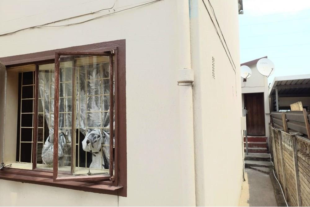 This Two Bedroom Double Storey House with a Double Storey Outbuilding