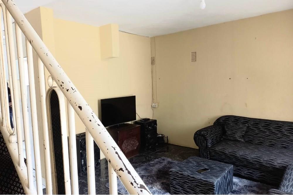 This Two Bedroom Double Storey House with a Double Storey Outbuilding