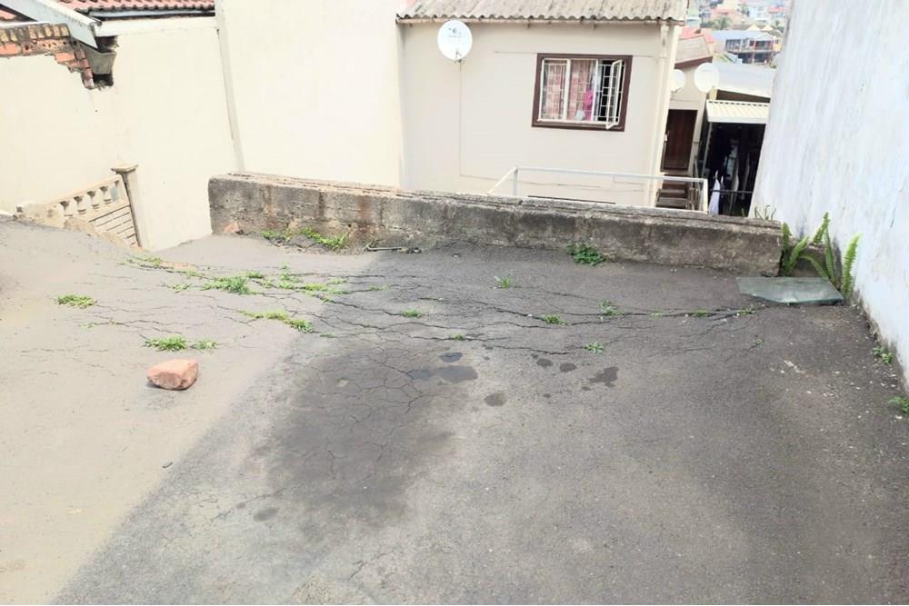 This Two Bedroom Double Storey House with a Double Storey Outbuilding