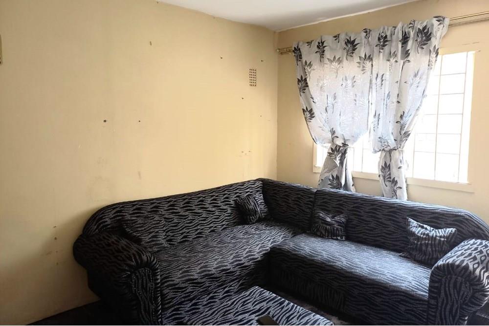 This Two Bedroom Double Storey House with a Double Storey Outbuilding